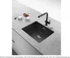 A black kitchen sink with a black faucet on a speckled gray countertop, with small bowls of berries and cream nearby. Podgląd zdjęcia produktu
