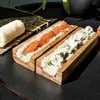 A sushi-making kit with rice and salmon in one compartment and rice and a creamy filling in another. Náhľad obrázku produktu