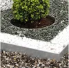 A close-up view of garden edging separating different types of gravel and a small bush. Produktbild-Vorschau