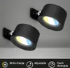 Two black wall lights are mounted on a gray ceiling. The lights have adjustable heads and emit a warm and cool white light. Below the lights, there are icons and text describing features like 'White change', 'Adjustable', and 'Touch dimmable'. Anteprima dell’immagine prodotto