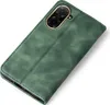 A green flip cover phone case is shown from a diagonal angle against a white background. Produktbild-Vorschau