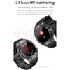 Two smartwatches are displayed with a background graphic of a heart rate monitor. Náhled obrázku produktu