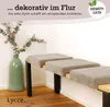A bench cushion is shown on a wooden floor in a corner, next to a green vase with greenery. Anteprima dell’immagine prodotto