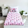A child's bed with Minnie Mouse themed bedding. Podgląd zdjęcia produktu
