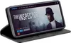 A smartphone in a black flip case is displayed, showing a movie streaming interface on its screen. Produktbild-Vorschau