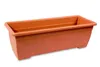A terracotta-colored plastic planter box with a water reservoir. Anteprima dell’immagine prodotto