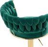 Close-up of a green velvet bar stool with a braided backrest and a gold base. Voir les images du produit