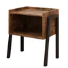A rustic-style nightstand with a wooden finish and black metal legs, presented against a white background. Podgląd zdjęcia produktu