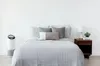 A bedroom scene with an air purifier next to a bed. Anteprima dell’immagine prodotto