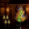 Outdoor garden decoration at night, featuring solar-powered cypress trees with colorful LED lights. Anteprima dell’immagine prodotto