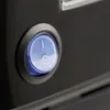 A close-up of a blue power switch on a black electronic device. Produktbild-Vorschau