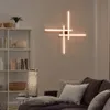 A modern living room with a wall lamp and a bookshelf. Produktbild-Vorschau