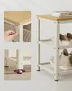 Close-up shots of a multi-tiered shelf unit, highlighting assembly details and product placement. Produktbild-Vorschau