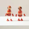 Two wooden firefighter toys are standing on a white surface against a white background. Produktbild-Vorschau