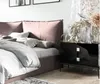 A bedroom scene with a bed and a nightstand. Produktbild-Vorschau