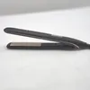 A black and gold hair straightener is shown on a white background. Náhľad obrázku produktu
