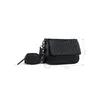 A black handbag and a small matching pouch are displayed against a white background, with dimensions indicated by lines and numbers. Produktbild-Vorschau