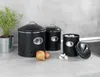 Kitchen counter with storage containers, onions, and garlic. Anteprima dell’immagine prodotto
