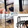 A collage of images showing a black metal garment rack with shelves, including assembly, close-ups of the legs, the rack with clothes and shoes, and a close-up of the top of the rack with hangers. Produktbild-Vorschau