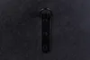 A black metal hanging bracket with a ring on a black textured background. Produktbild-Vorschau