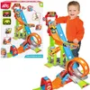 A child playing with a toy car race track. Voir les images du produit