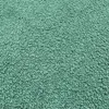 A close-up view of a textured green fabric, likely upholstery. Voir les images du produit