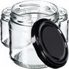 Several empty glass jars with black lids are arranged in a group. Anteprima dell’immagine prodotto