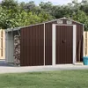 A brown metal shed with an attached open storage area for firewood, set in a backyard with a lawn and trees. Anteprima dell’immagine prodotto