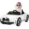 A young girl is sitting in a white toy BMW car. Produktbild-Vorschau