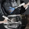 A collage showing a handheld vacuum cleaner being used to clean car seats and a computer. Produktbild-Vorschau