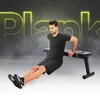 A man is performing a dip exercise on a black weight bench, with the word "Plank" in large neon yellow letters in the background. Náhľad obrázku produktu
