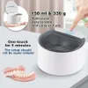 A collage of images showing a compact ultrasonic cleaner, its dimensions, capacity, weight, and features, along with a pair of dentures. Produktbild-Vorschau