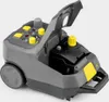 A KÄRCHER SG 4/4 Dampfreiniger (steam cleaner) is shown from a diagonal front-top view against a plain light gray background. The lid is open, revealing the water tank and a yellow cap. Voir les images du produit