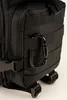 A close-up view of a black backpack with a carabiner attached. Náhled obrázku produktu