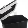 A close-up view of a black trash can with its lid open, showing the interior. Anteprima dell’immagine prodotto