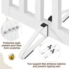 Close-up view of the bottom section of a white wooden pet gate, highlighting its protective pads and support feet. Podgląd zdjęcia produktu
