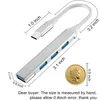 A silver USB C hub with dimensions indicated by measurement lines and text, alongside a coin for scale. Produktbild-Vorschau