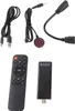 A collection of electronic accessories including a remote control, a streaming stick, and various cables, laid out on a white background. Produktbild-Vorschau