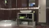 A modern bathroom with brown tiled walls, a shower, a sink with a vanity, and a tall cabinet. Produktbild-Vorschau