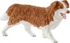 A toy dog figurine on a white background. Anteprima dell’immagine prodotto