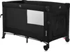 A black travel cot is shown in a studio setting against a white background. Voir les images du produit