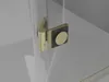 A close-up view of a shower door hinge with a brushed gold finish and a black square plate with a circular gold accent. Produktbild-Vorschau
