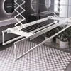 A white ceiling-mounted clothes drying rack is shown in a modern bathroom setting. Produktbild-Vorschau