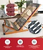 A slatted bed base is shown in an angled, partially raised position, with close-up insets highlighting specific features. The bottom of the image features a red banner with icons and text describing product features. Produktbild-Vorschau