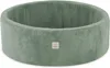A green corduroy ball pit with a small logo tag on the front. Podgląd zdjęcia produktu