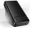 A black power bank is shown at an angle on a light gray surface. Produktbild-Vorschau