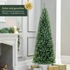 A Christmas tree is shown next to a fireplace with gifts underneath. Podgląd zdjęcia produktu