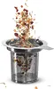 A tea strainer with loose tea leaves falling into it. Anteprima dell’immagine prodotto