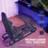A racing simulator cockpit with a gaming chair and pedals, set up in a room with ambient lighting and a monitor displaying a racing game. Produktbild-Vorschau