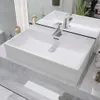 A modern bathroom sink with a chrome faucet, set against a tiled wall and marble countertop. Produktbild-Vorschau